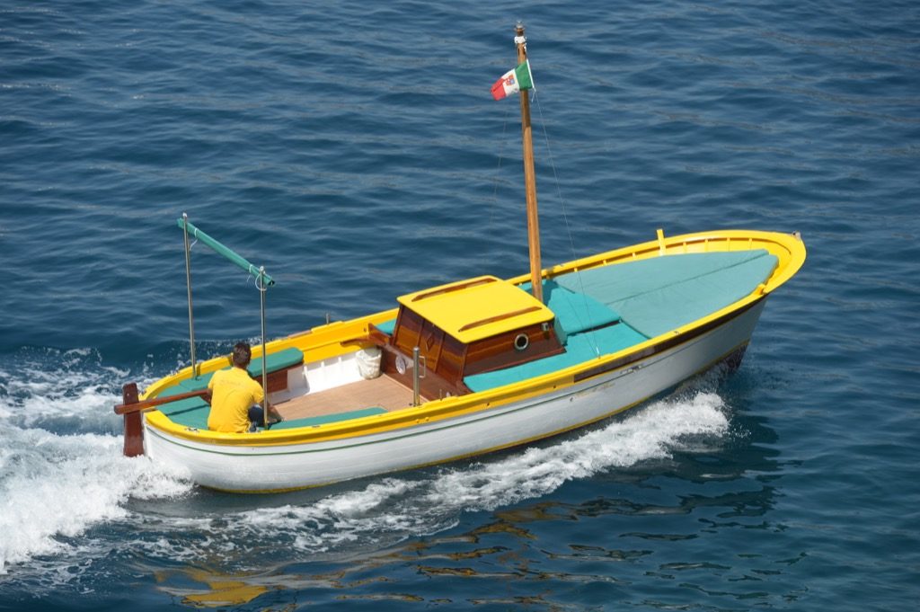 Traditional gozzo boat S. Luca view from above in open sea