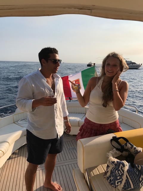 A couple drinking prosecco on the boat