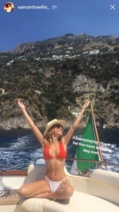An happy girl with hat during an amazing day on the boat